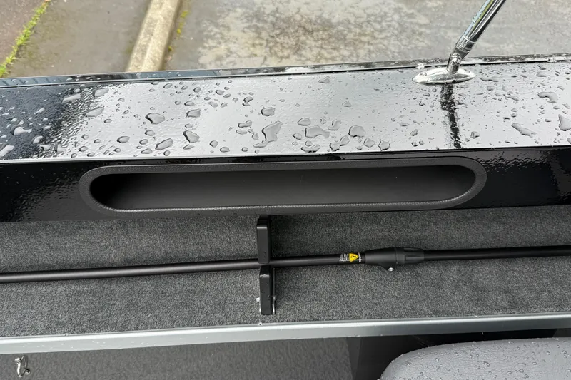 Slide: The Image of 2026 Smoker Craft Osprey 172 boat interior with wet surfaces and rod holder. - 24