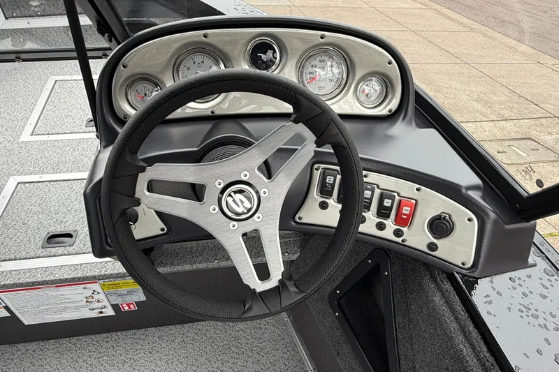 Slide: The Image of Steering console of 2026 Smoker Craft Osprey 172 boat with gauges and controls. - 5