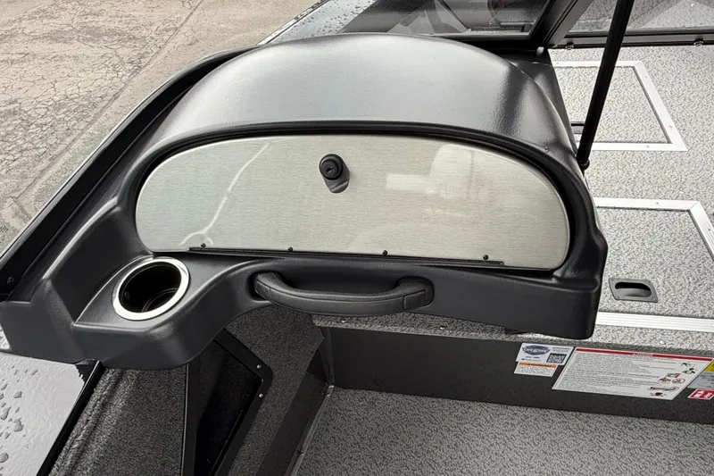 Slide: The Image of 2026 Smoker Craft Osprey 172 boat dashboard with cup holder and storage compartment. - 6