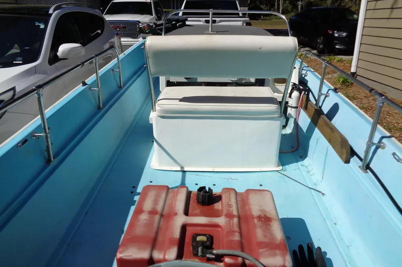Slide: The Image of 1970 Boston Whaler 17 Montauk boat interior with seating and fuel tank. - 6
