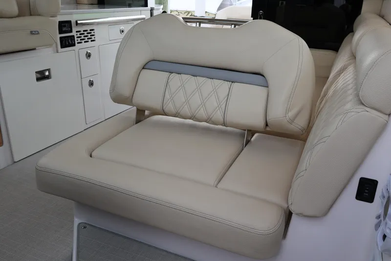 Slide: The Image of Luxurious beige seating in 2022 Regal 36 XO boat interior. - 27