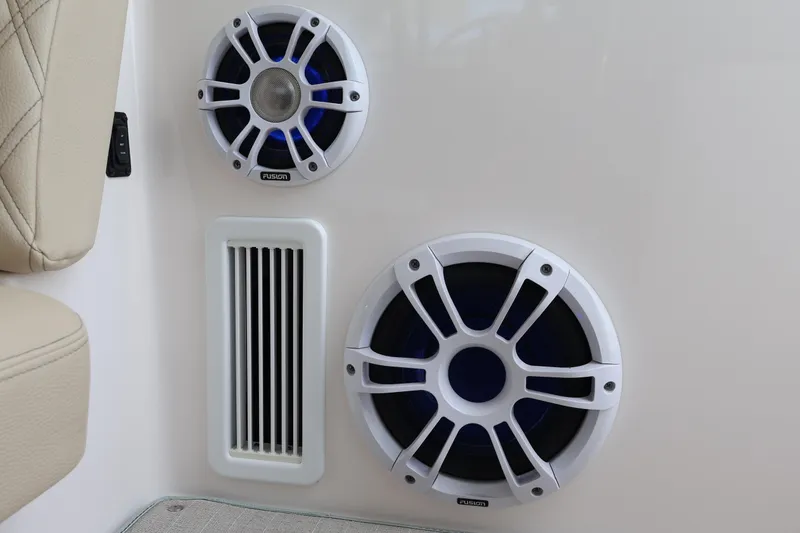 Slide: The Image of 2022 Regal 36 XO boat speakers and vent detail, featuring Fusion audio system. - 28