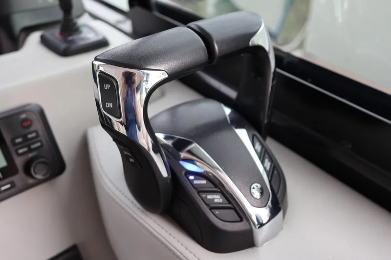 Slide: The Image of Throttle control of 2022 Regal 36 XO boat, featuring sleek design and modern controls. - 39
