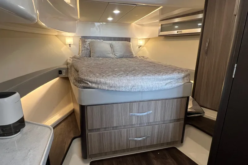 Slide: The Image of Luxurious cabin interior of 2022 Regal 36 XO yacht with cozy bed and modern design. - 43