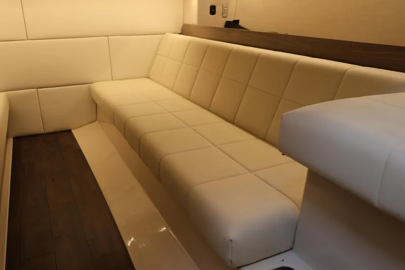 Slide: The Image of Luxurious interior seating of 2022 Regal 36 XO yacht with cream upholstery. - 50