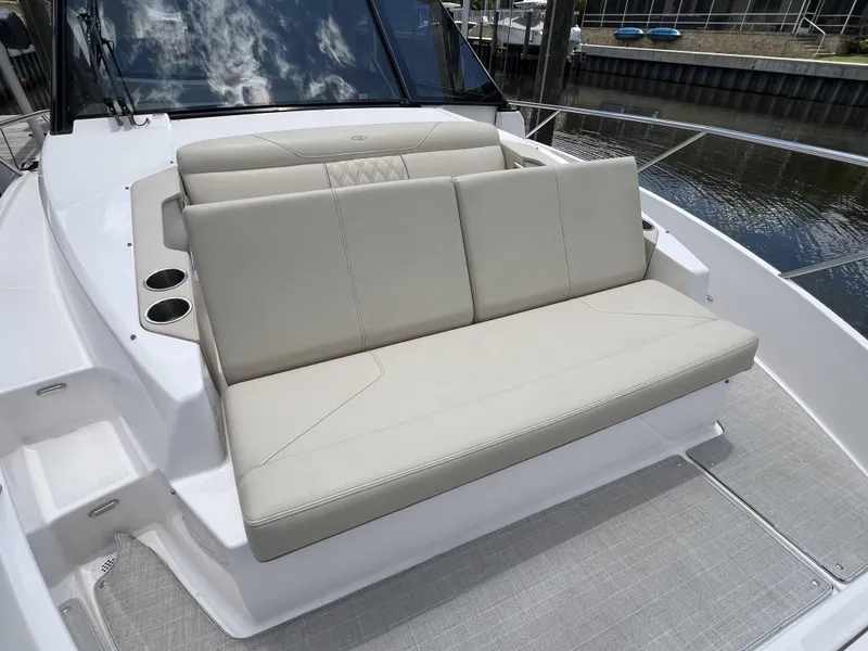 Slide: The Image of 2022 Regal 36 XO boat with comfortable seating and cup holders. - 58