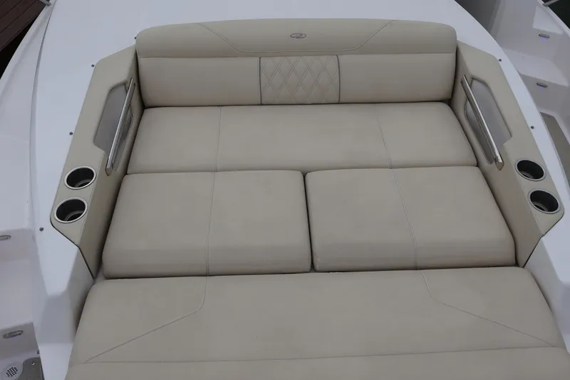 Slide: The Image of Luxurious seating area on 2022 Regal 36 XO boat with cup holders. - 60