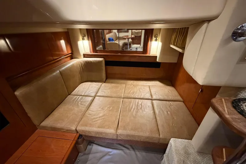 Slide: The Image of Luxurious interior of 2005 Sea Ray 390 Sundancer yacht with plush seating. - 10