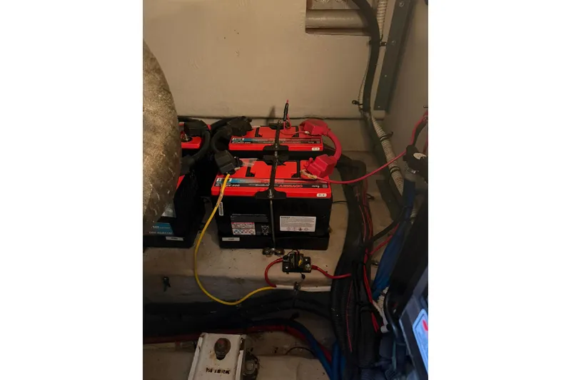 Slide: The Image of Engine compartment of a 2005 Sea Ray 390 Sundancer with batteries and wiring. - 27