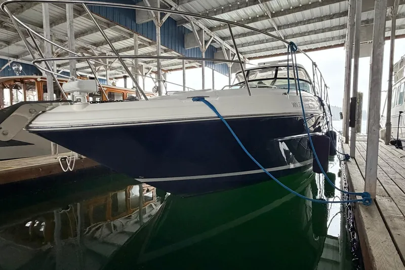 Slide: The Image of 2005 Sea Ray 390 Sundancer yacht docked in a covered marina. - 3