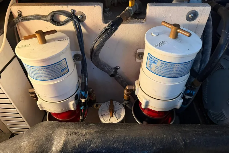 Slide: The Image of Diesel fuel filters in 2005 Sea Ray 390 Sundancer engine compartment. - 30