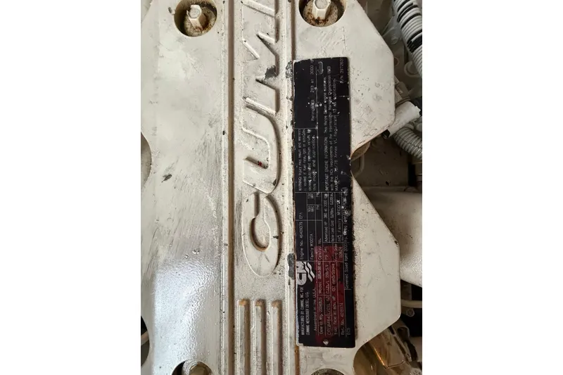 Slide: The Image of Engine detail of a 2005 Sea Ray 390 Sundancer with Cummins branding. - 34