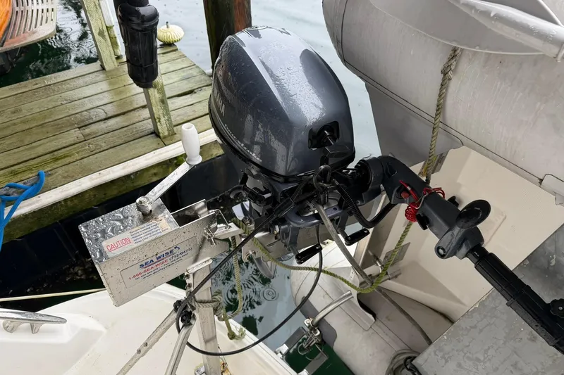 Slide: The Image of Outboard motor on a 2005 Sea Ray 390 Sundancer docked by wooden pier. - 39