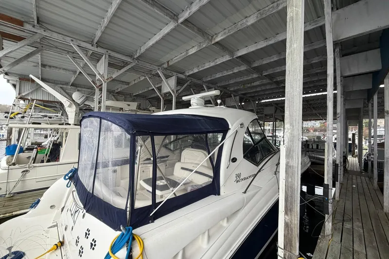 Slide: The Image of 2005 Sea Ray 390 Sundancer yacht docked under a covered marina. - 7