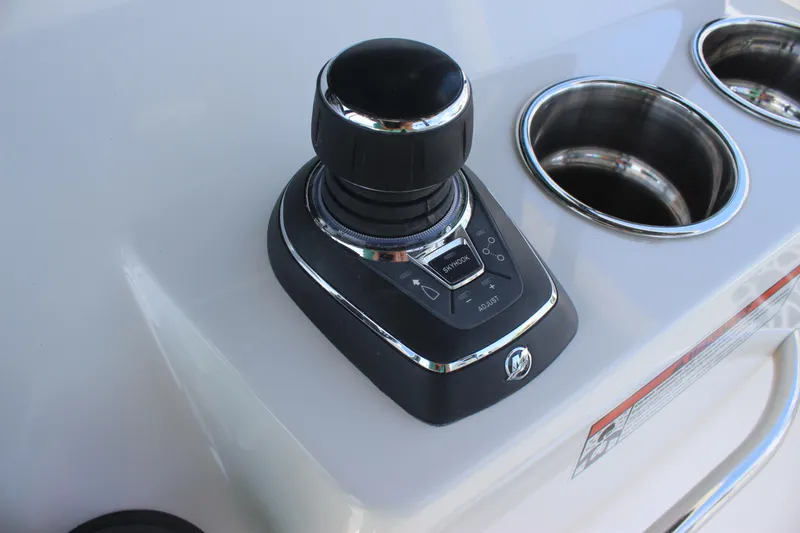 Slide: The Image of Joystick control on 2023 Crevalle 33 CSF boat console with cup holders. - 17