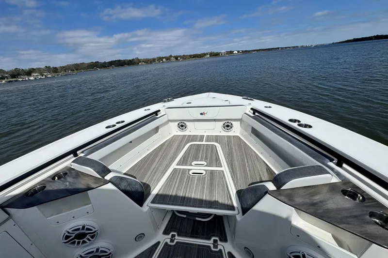 Slide: The Image of 2023 Crevalle 33 CSF boat interior with spacious seating and scenic water view. - 9