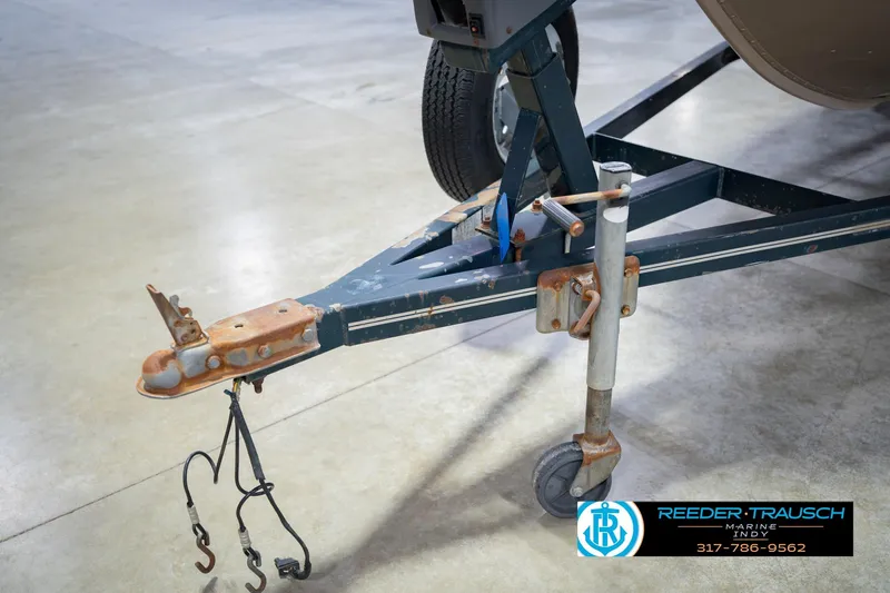 Slide: The Image of Trailer hitch of a 1999 Lund 1650 Explorer SS boat with visible rust. - 43