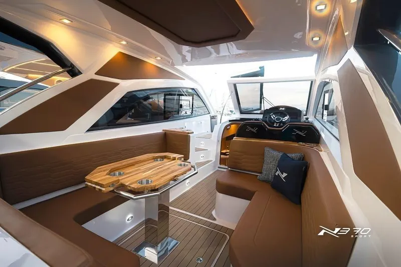 Slide: The Image of Luxurious interior of 2026 NX Boats NX370, featuring elegant seating and modern design. - 12