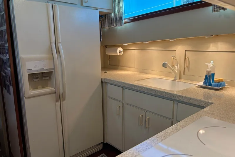 Slide: The Image of Kitchen area of a 1979 Hatteras 53 Motor Yacht with modern appliances. - 19