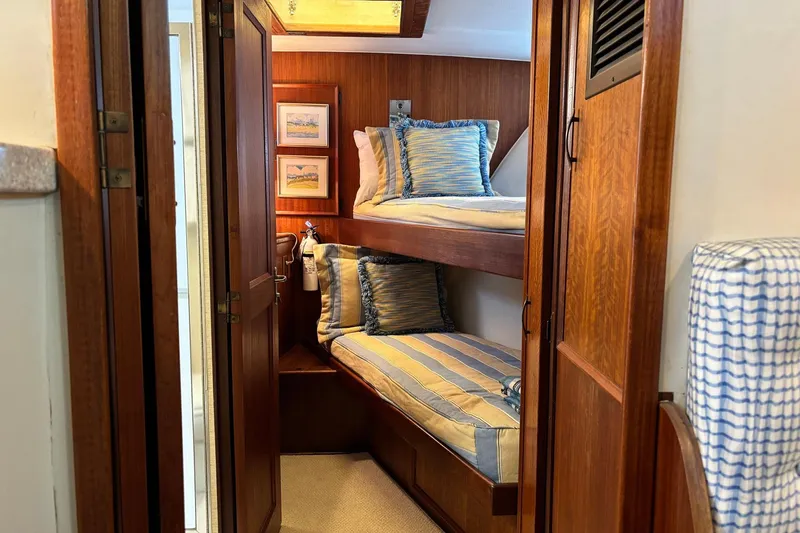 Slide: The Image of 1979 Hatteras 53 Motor Yacht cabin with cozy bunk beds and nautical decor. - 21