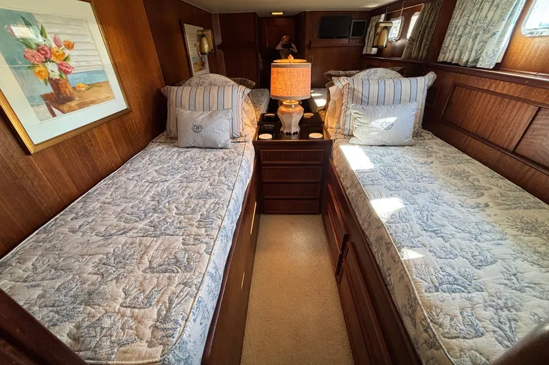 Slide: The Image of Interior of 1979 Hatteras 53 Motor Yacht with twin beds and elegant decor. - 30