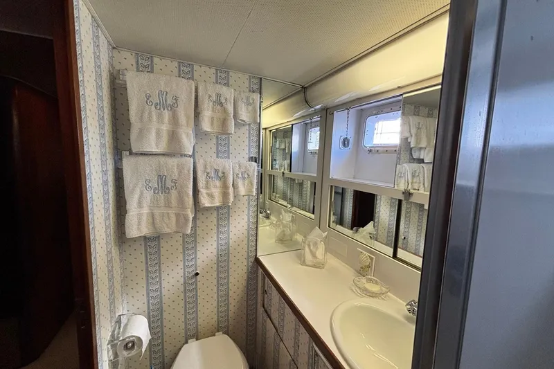 Slide: The Image of Bathroom interior of 1979 Hatteras 53 Motor Yacht with towels and vanity mirror. - 32