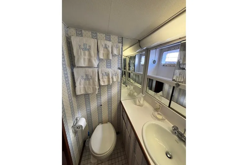 Slide: The Image of Bathroom interior of 1979 Hatteras 53 Motor Yacht with towels and vanity mirror. - 33