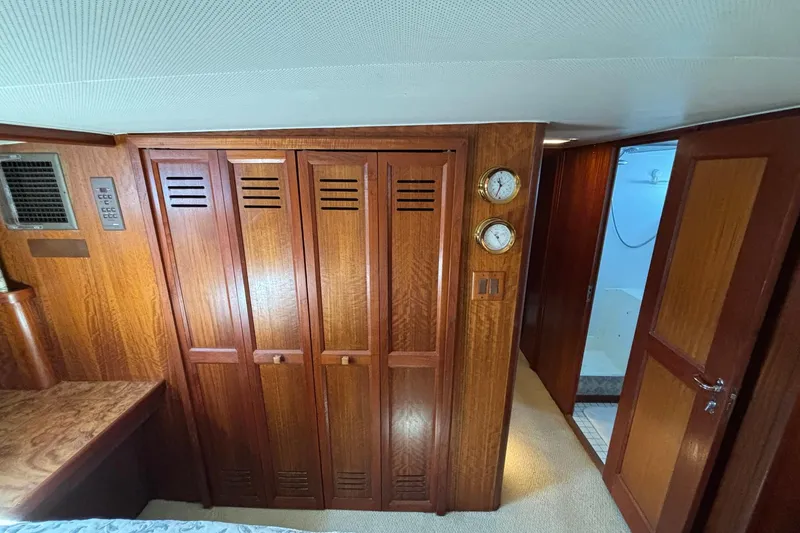 Slide: The Image of Interior of 1979 Hatteras 53 Motor Yacht with wooden cabinetry and nautical instruments. - 39