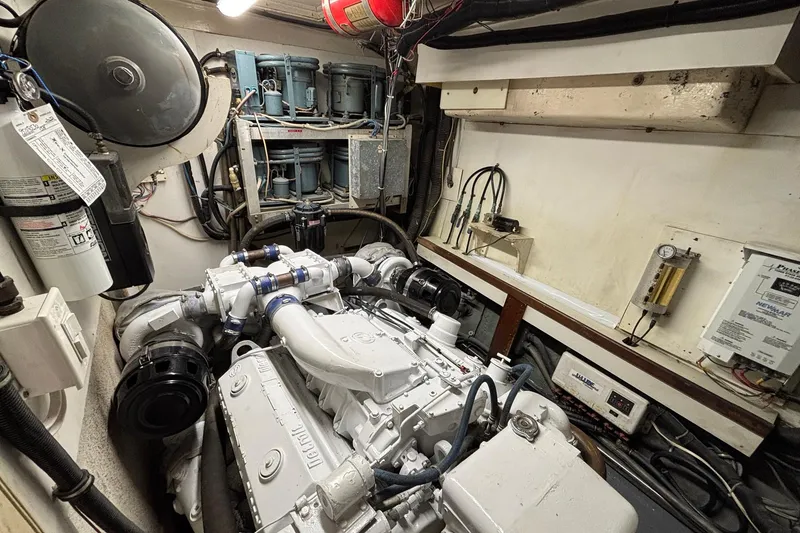 Slide: The Image of Engine room of a 1979 Hatteras 53 Motor Yacht, showcasing mechanical components. - 60