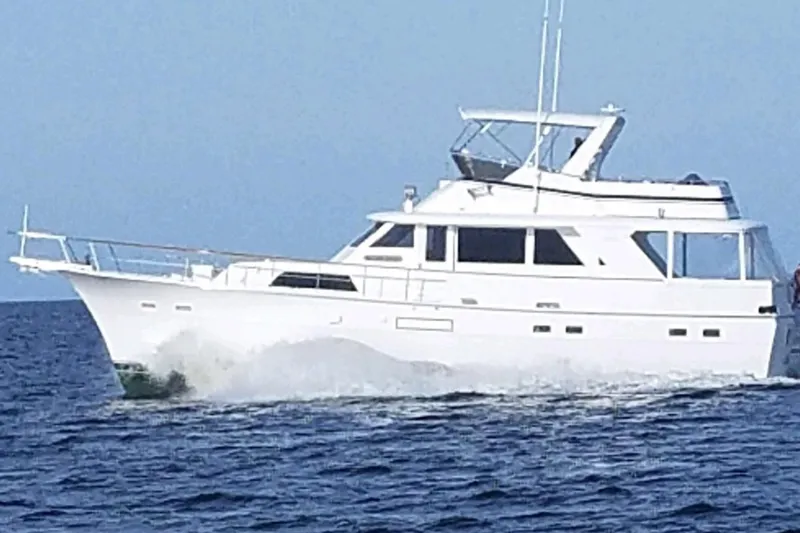 Slide: The Image of 1979 Hatteras 53 Motor Yacht cruising on open water. - 63