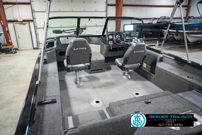Slide: The Image of 2022 Lund 1875 Impact boat interior with dual seats and steering console. - 15