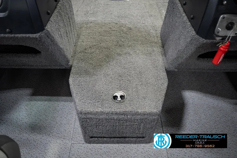 Slide: The Image of 2022 Lund 1875 Impact boat interior with carpeted flooring and storage compartment. - 27