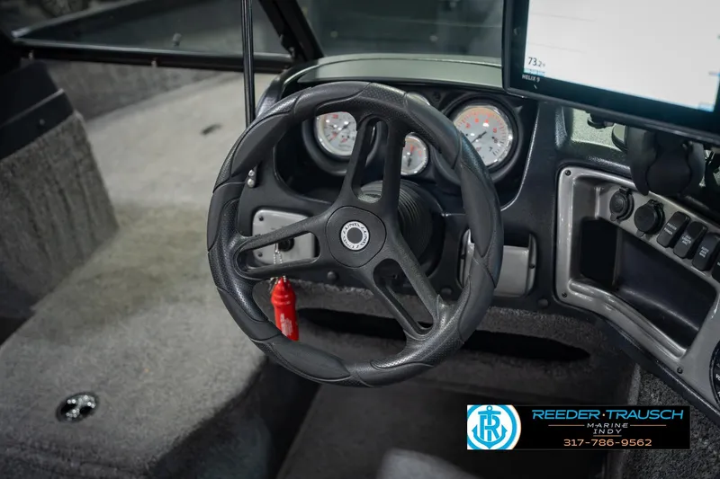 Slide: The Image of 2022 Lund 1875 Impact boat dashboard with steering wheel and gauges. - 31