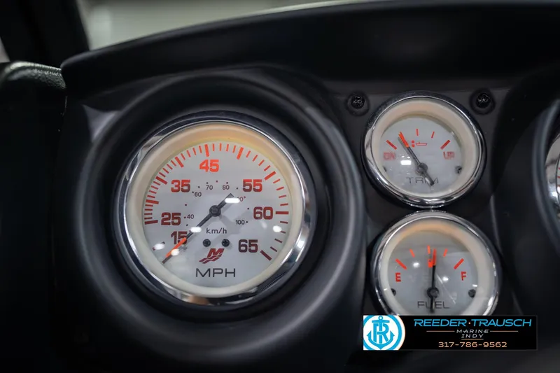Slide: The Image of Close-up of 2022 Lund 1875 Impact boat dashboard gauges, including speedometer and fuel indicators. - 34