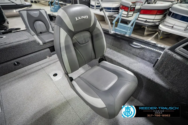 Slide: The Image of 2022 Lund 1875 Impact boat interior with gray seating and carpeted flooring. - 42