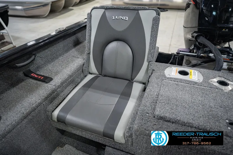 Slide: The Image of 2022 Lund 1875 Impact boat seat with gray upholstery and storage compartment. - 43