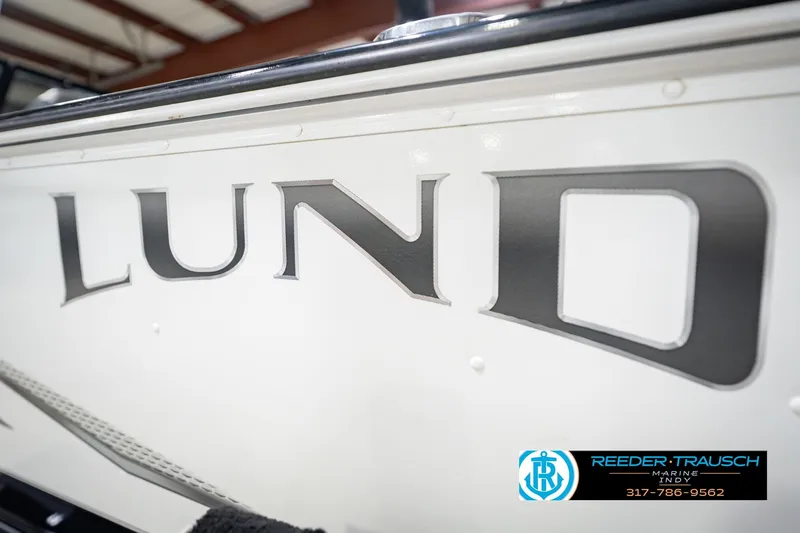 Slide: The Image of 2022 Lund 1875 Impact boat logo with Reeder-Trausch Marine contact details. - 56