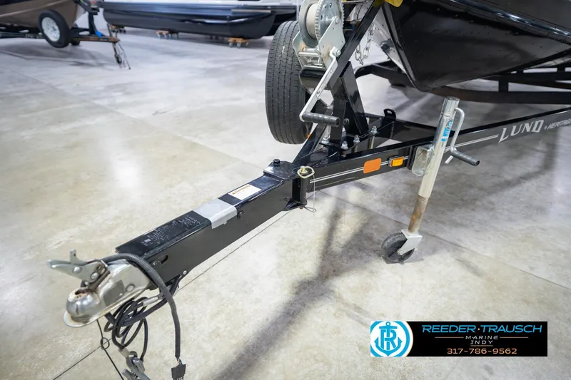 Slide: The Image of Trailer hitch of 2022 Lund 1875 Impact boat in showroom setting. - 58