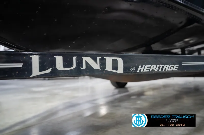 Slide: The Image of 2022 Lund 1875 Impact boat trailer by Heritage, displayed at Reeder-Trausch Marine. - 60