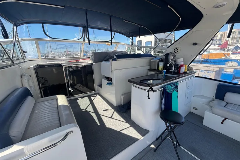 Slide: The Image of Interior of 1987 Californian 44 Veneti yacht with seating and kitchenette. - 5