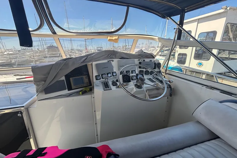 Slide: The Image of Cockpit of 1987 Californian 44 Veneti yacht with steering wheel and navigation equipment. - 6