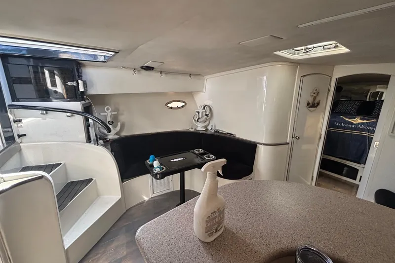 Slide: The Image of Interior of 1987 Californian 44 Veneti yacht with modern seating and nautical decor. - 7