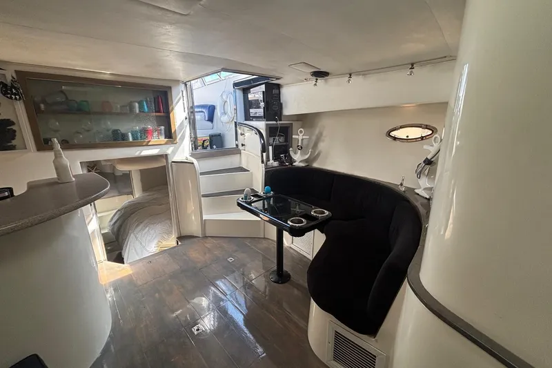 Slide: The Image of Interior of 1987 Californian 44 Veneti yacht with cozy seating and modern decor. - 8