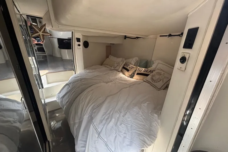 Slide: The Image of Cozy cabin interior of 1987 Californian 44 Veneti yacht with plush bedding and nautical decor. - 9