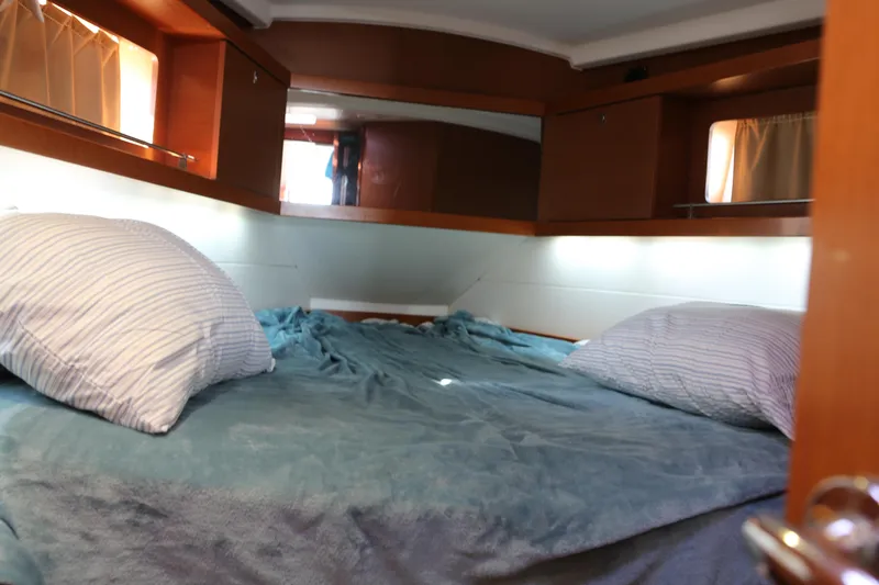 Slide: The Image of Cozy cabin interior of 2014 Beneteau Oceanis 41 sailboat with comfortable bedding. - 17