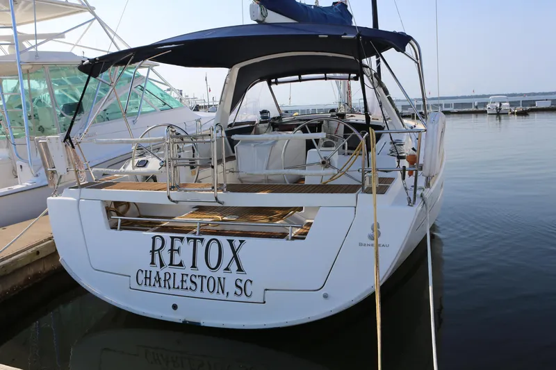 Slide: The Image of 2014 Beneteau Oceanis 41 sailboat docked, named "Retox," in Charleston, SC marina. - 2