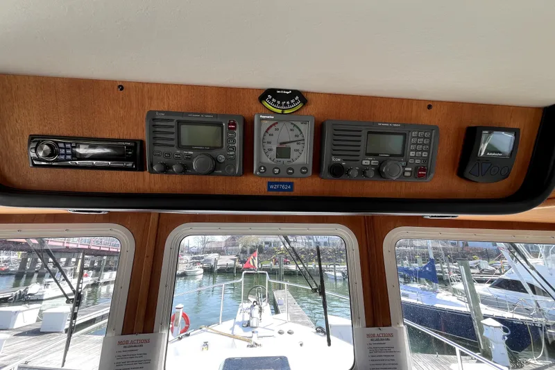 Slide: The Image of Pilothouse of 2008 Nordic Tug 42 with navigation instruments and marina view. - 16