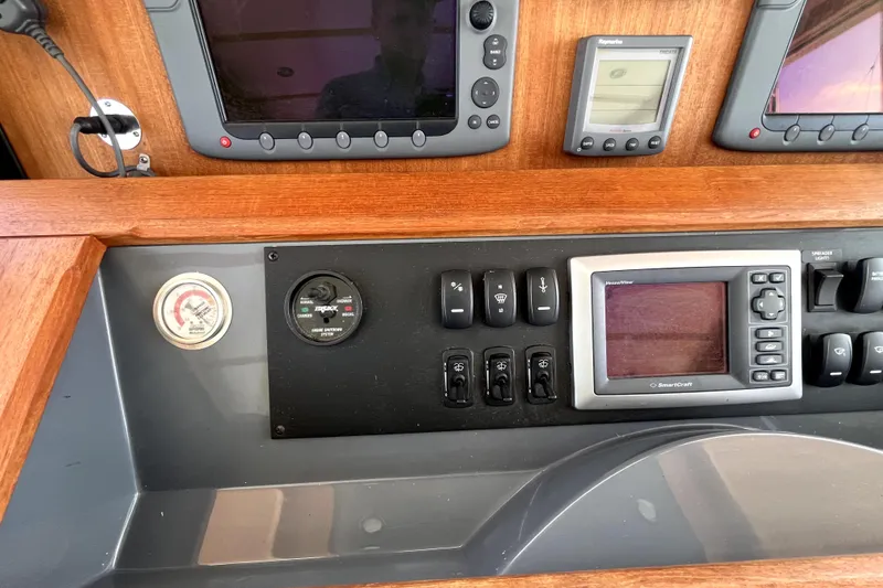 Slide: The Image of Control panel of a 2008 Nordic Tug 42 with navigation and monitoring instruments. - 17