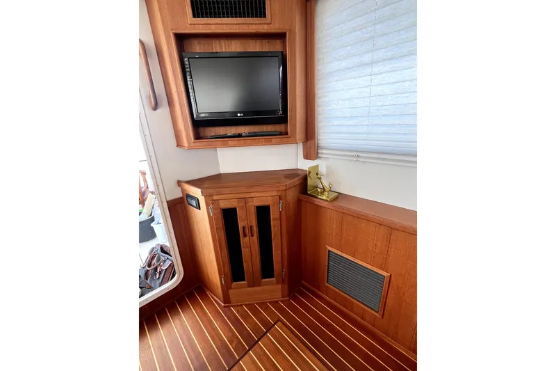 Slide: The Image of Interior of 2008 Nordic Tug 42 with wood cabinetry and mounted TV. - 23