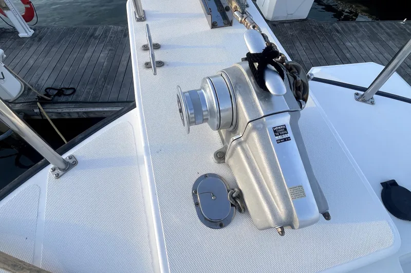 Slide: The Image of Nordic Tug 42 (2008) deck with anchor windlass and chain, dockside view. - 47